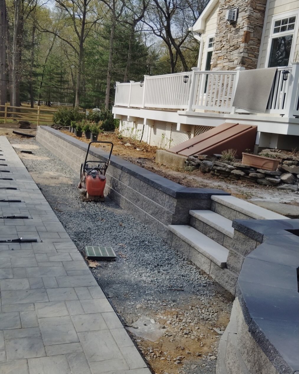 Crew building a retaining wall and steps